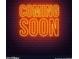 Eye-catching neon sign that reads 'Coming Soon' at 15814 W Adams St, Goodyear, AZ 85338