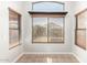 Bright breakfast nook with decorative wood blinds and tile flooring at 15814 W Adams St, Goodyear, AZ 85338