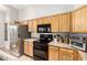 Efficient kitchen layout featuring modern appliances, ample counter space, and plenty of storage cabinets at 15814 W Adams St, Goodyear, AZ 85338