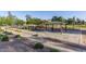 Community picnic area with shaded ramada, picnic tables and walking paths surrounded by lush landscaping at 16333 N 181St Ave, Surprise, AZ 85388