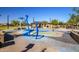 Community splash pad with colorful features and play areas, ideal for children to enjoy outdoor water play at 16333 N 181St Ave, Surprise, AZ 85388
