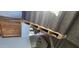 Renovations underway on a staircase with carpeted steps and a wooden railing under construction, leading to an open living area at 16789 W Moreland St, Goodyear, AZ 85338