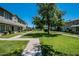Attractive townhomes set amidst lush landscaping and mature trees, creating a peaceful residential setting at 2645 W Elm St, Phoenix, AZ 85017