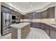 Kitchen with stainless steel appliances, custom cabinets, and island at 28770 N 69Th Ln, Peoria, AZ 85383