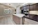 Gourmet kitchen featuring a center island and stainless steel appliances at 28770 N 69Th Ln, Peoria, AZ 85383