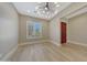 Bright living room features wood flooring and a decorative chandelier at 28770 N 69Th Ln, Peoria, AZ 85383