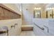 Bathroom showing tiled shower with showerhead and seat at 28770 N 69Th Ln, Peoria, AZ 85383