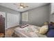 Bedroom featuring wood-look floors, a ceiling fan, and a large closet with plenty of space at 6264 E Omega St, Mesa, AZ 85215