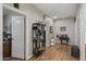 Bright hallway with wood floors, art decorations, and a view into the adjacent rooms at 6264 E Omega St, Mesa, AZ 85215