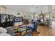 An eclectic living room featuring colorful rug, fireplace, and dining table with decorative chandelier at 6264 E Omega St, Mesa, AZ 85215