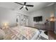 Serene main bedroom with modern gray walls, beautiful lighting, and stylish décor at 6264 E Omega St, Mesa, AZ 85215