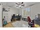 Home office featuring ample storage, a ceiling fan, and a large window with natural light at 6264 E Omega St, Mesa, AZ 85215