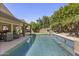 Beautiful backyard pool with water features and lush landscaping at 6264 E Omega St, Mesa, AZ 85215