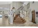 Beautiful staircase with decorative art and architectural details lead to the upper level of the home at 6264 E Omega St, Mesa, AZ 85215