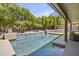 Gorgeous swimming pool surrounded by lush greenery and desert landscaping at 6264 E Omega St, Mesa, AZ 85215