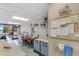 A craft room featuring workbenches, storage cabinets, natural light, and plenty of space for creative projects at 6942 S Championship Dr, Chandler, AZ 85249