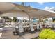 Large outdoor event space with tables and chairs under a shaded canopy for social gatherings or community events at 6942 S Championship Dr, Chandler, AZ 85249