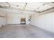 Spacious garage with ample storage cabinets and a work bench at 6942 S Championship Dr, Chandler, AZ 85249