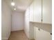 Large laundry room with storage cabinets and washer/dryer hookups at 6942 S Championship Dr, Chandler, AZ 85249