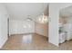Spacious living room with tile flooring, ceiling fan, and view of adjacent kitchen at 6942 S Championship Dr, Chandler, AZ 85249