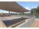 Community shuffleboard court with a sun shade for a fun outdoor activity at 6942 S Championship Dr, Chandler, AZ 85249