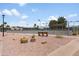 Tennis courts featuring shady areas and desert landscaping at 6942 S Championship Dr, Chandler, AZ 85249