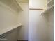 Walk-in closet featuring shelving, racks, and a neutral interior at 6942 S Championship Dr, Chandler, AZ 85249
