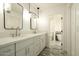Bathroom boasts double sinks with modern fixtures, marbled floors, and a separate toilet room at 8425 E Welsh Trl, Scottsdale, AZ 85258