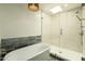 Bathroom features a freestanding tub and a walk-in shower with glass door and tiled walls at 8425 E Welsh Trl, Scottsdale, AZ 85258