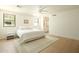 Bright bedroom with white walls, wood floors, and large windows providing plenty of natural light at 8425 E Welsh Trl, Scottsdale, AZ 85258