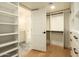 Walk-in closet with custom built-in shelving and storage, providing ample space for organization at 8425 E Welsh Trl, Scottsdale, AZ 85258