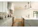 Bright kitchen boasting an island with white marble countertops and stainless steel appliances at 8425 E Welsh Trl, Scottsdale, AZ 85258