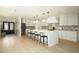 Open concept kitchen with island, stainless steel appliances, pendant lights, and a breakfast bar at 8425 E Welsh Trl, Scottsdale, AZ 85258