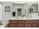 Bathroom featuring double sinks in a vanity and a large mirror at 1033 E Mountain Vista Dr, Phoenix, AZ 85048