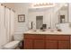Bright bathroom features a dual sink vanity, framed mirror, and shower-tub combination at 1033 E Mountain Vista Dr, Phoenix, AZ 85048