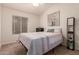 Bright bedroom includes natural lighting, a neutral color palette, and ample space at 1033 E Mountain Vista Dr, Phoenix, AZ 85048