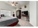 Bright bedroom with a vaulted ceiling, a large window, and neutral carpet at 1033 E Mountain Vista Dr, Phoenix, AZ 85048