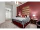 Bedroom with a patterned tapestry accenting a deep red wall at 1033 E Mountain Vista Dr, Phoenix, AZ 85048