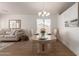 Dining area featuring a chandelier and adjacent living room at 1033 E Mountain Vista Dr, Phoenix, AZ 85048