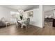 Bright dining area featuring a chandelier and views to the living room at 1033 E Mountain Vista Dr, Phoenix, AZ 85048