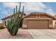 Charming single-story home with desert landscaping and a two-car garage at 1033 E Mountain Vista Dr, Phoenix, AZ 85048