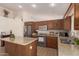 Updated kitchen with granite countertops, stainless steel appliances, and wooden cabinetry at 1033 E Mountain Vista Dr, Phoenix, AZ 85048