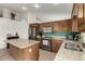 Modern kitchen with stainless steel appliances, granite countertops, and an island at 1033 E Mountain Vista Dr, Phoenix, AZ 85048