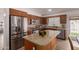 Updated kitchen with granite countertops, stainless steel appliances, and a center island at 1033 E Mountain Vista Dr, Phoenix, AZ 85048