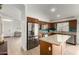 Modern kitchen with stainless steel appliances, granite countertops, and an island at 1033 E Mountain Vista Dr, Phoenix, AZ 85048