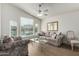 Bright living room featuring large windows, vaulted ceilings, and neutral decor at 1033 E Mountain Vista Dr, Phoenix, AZ 85048