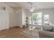Bright living room with large windows, ceiling fan, and comfortable seating at 1033 E Mountain Vista Dr, Phoenix, AZ 85048