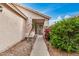 A charming entryway with a welcoming path lined with desert landscaping and a decorative 'WELCOME' sign at 10407 W Reade Ave, Glendale, AZ 85307