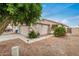 Exterior view featuring a well-maintained garage, drought-tolerant landscaping, and a welcoming entrance walkway at 10407 W Reade Ave, Glendale, AZ 85307