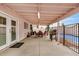 Covered patio featuring a dining area, barbecue, and access to the backyard pool at 10407 W Reade Ave, Glendale, AZ 85307